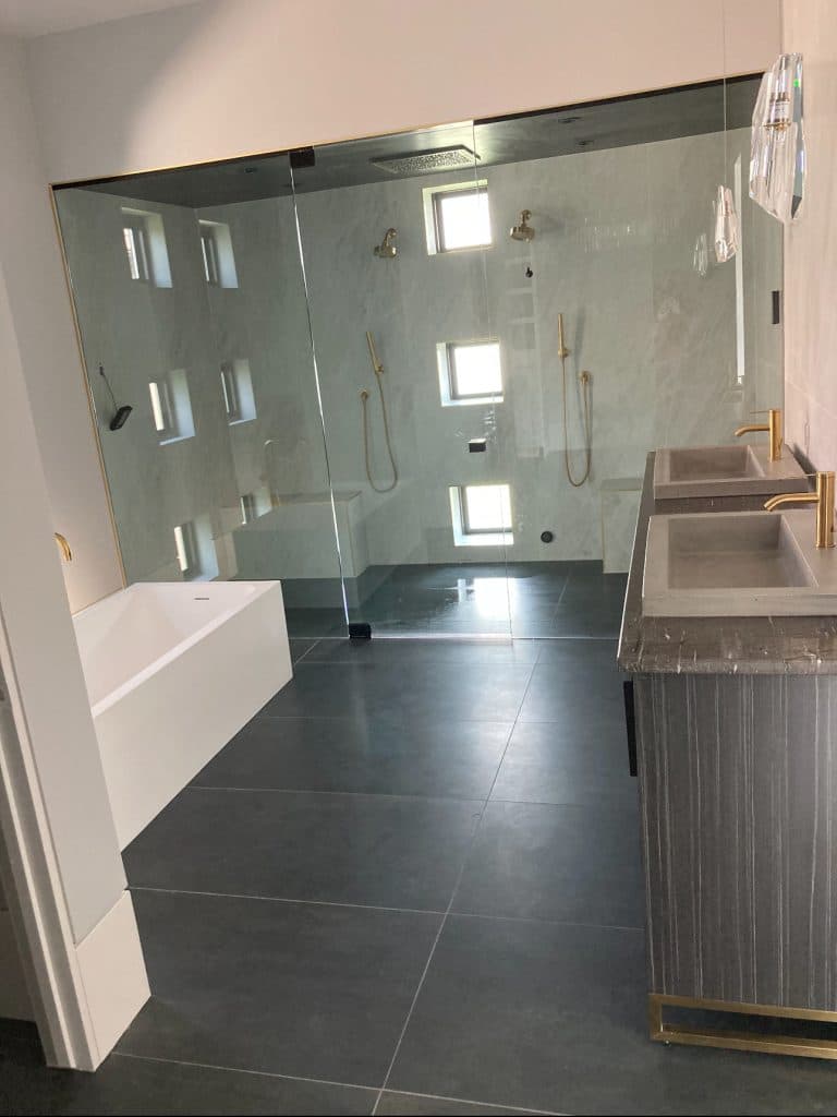 Contemporary bath with large-format tile and glass shower