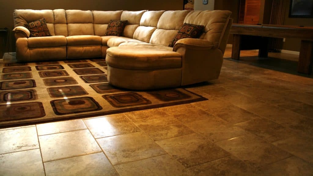 Family room with sectional, area rug, and tile flooring
