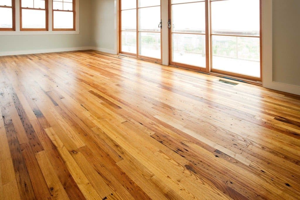 Sunlit room with reclaimed chestnut wood flooring